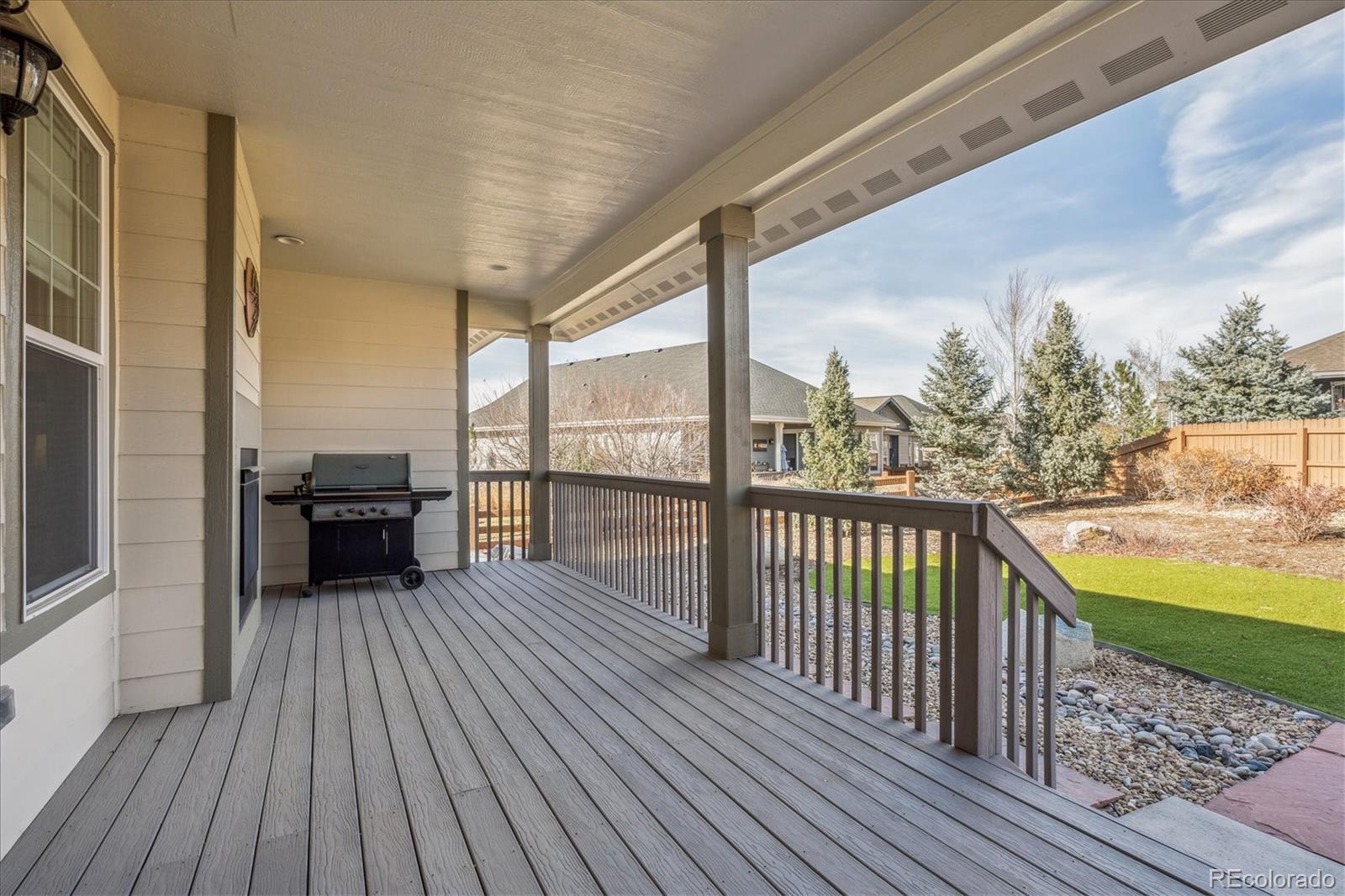 6667 Club Villa Road Parker, CO 80134 - Photo 31 of 50 a view of a balcony with mountain view and wooden floor