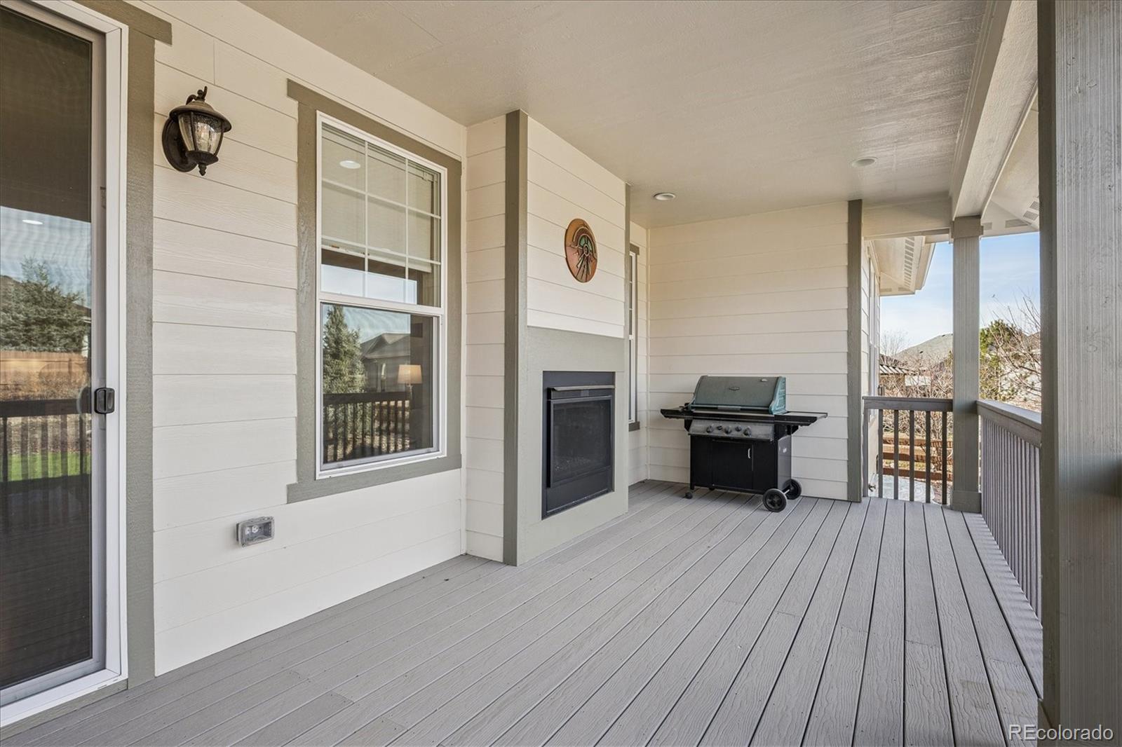 6667 Club Villa Road Parker, CO 80134 - Photo 32 of 50 a view of a livingroom with furniture and wooden floor