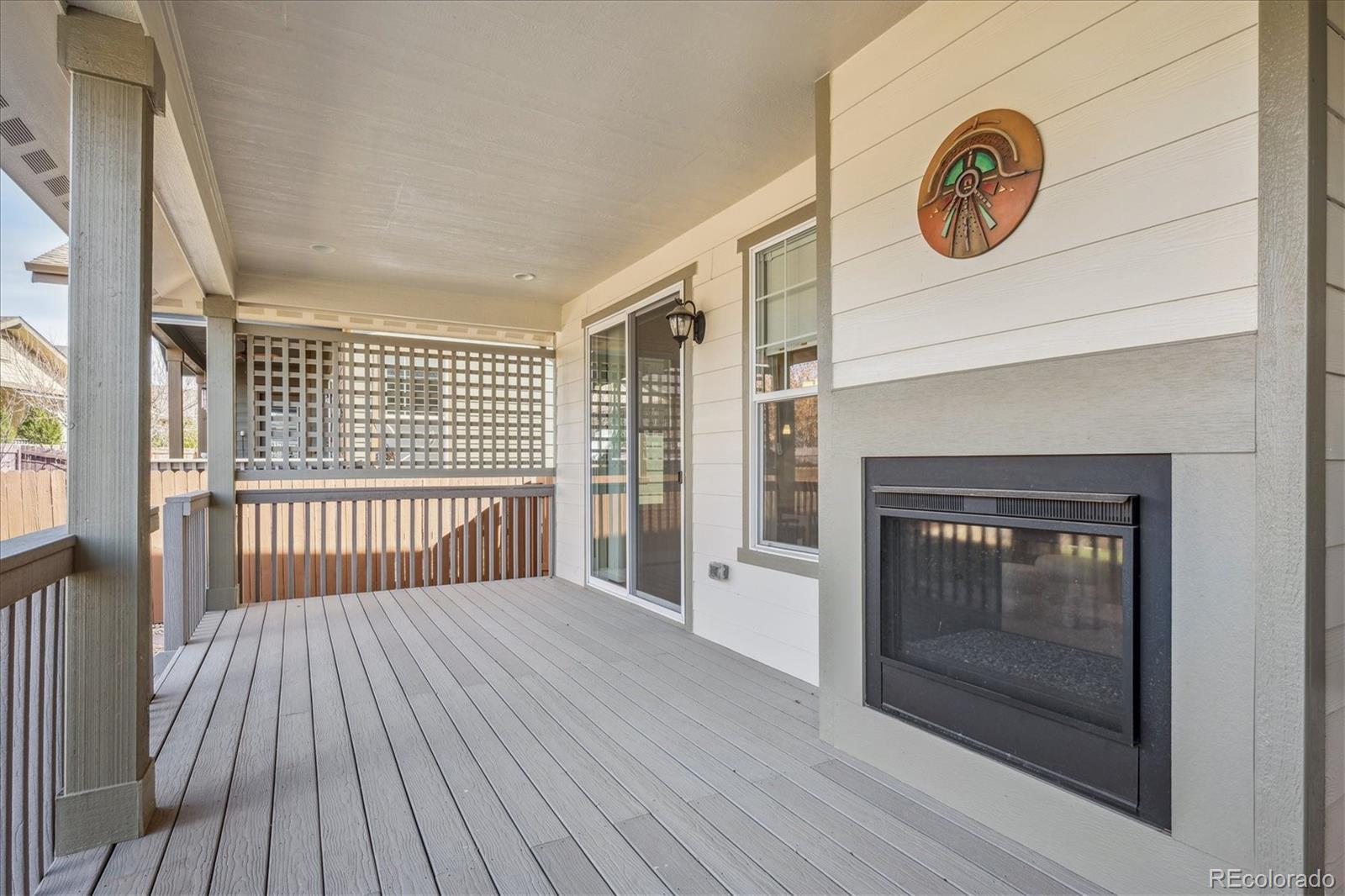 6667 Club Villa Road Parker, CO 80134 - Photo 33 of 50 a view of a livingroom with wooden floor and a fireplace