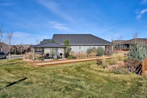 a view of a house with garden and yard