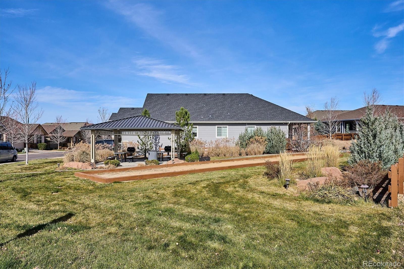 6667 Club Villa Road Parker, CO 80134 - Photo 34 of 50 a view of a house with garden and yard