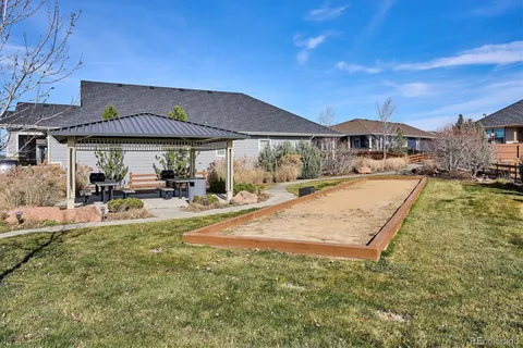 a view of a house with swimming pool and sitting area
