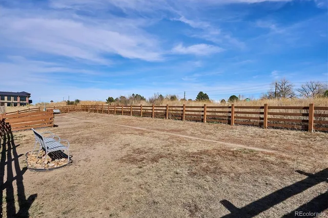 a view of a yard with an ocean view