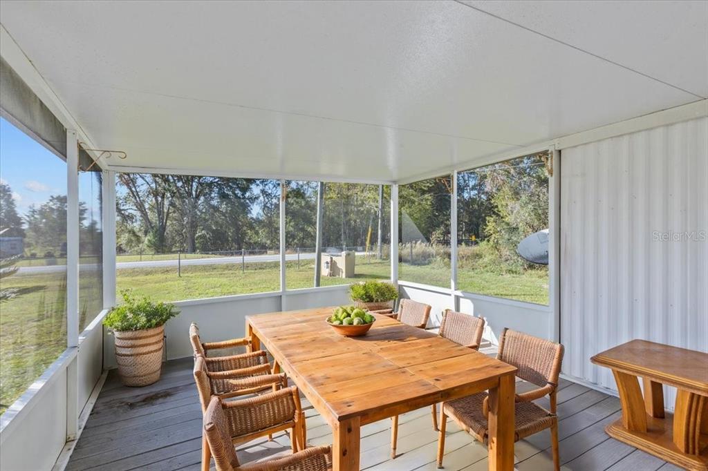 Undisclosed Address Bronson, FL 32621 - Photo 18 of 35 a view of a dining room with furniture window and outside view