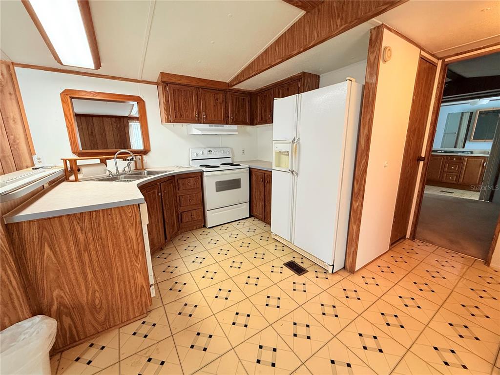 Undisclosed Address Bronson, FL 32621 - Photo 6 of 35 a kitchen with stainless steel appliances a refrigerator and a stove