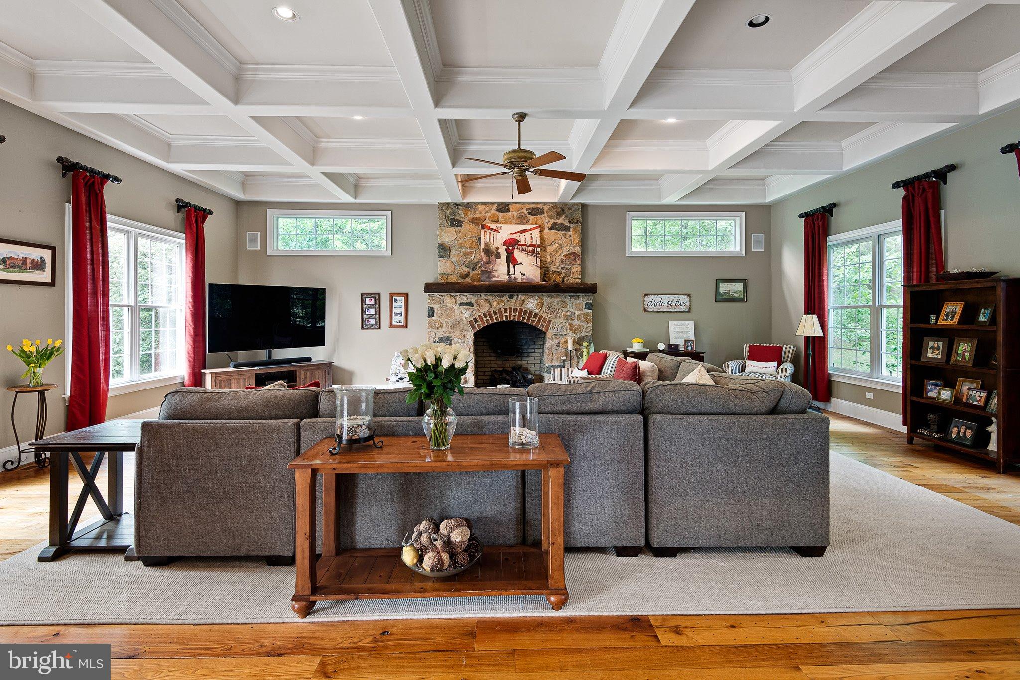104 Timber Ridge Lane Chadds Ford, PA 19317 - Photo 15 of 65 a living room with furniture a flat screen tv and a fireplace