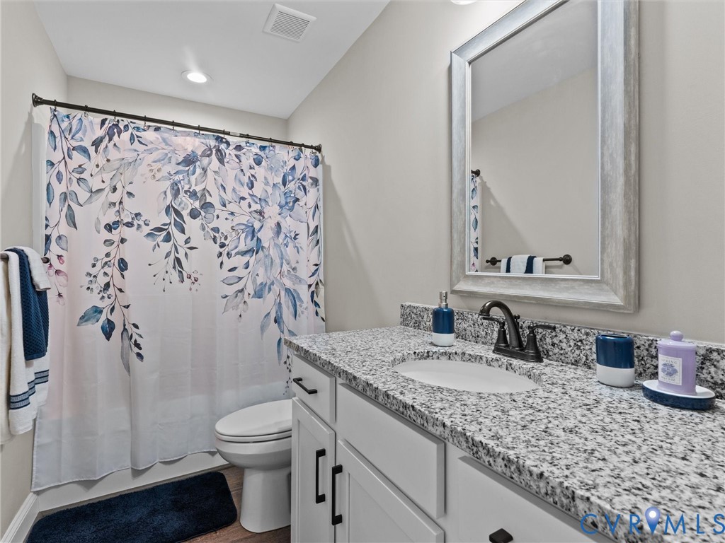 10819 Vaughan Road Petersburg, VA 23805 - Photo 37 of 45 Bathroom vanity featuring a granite countertop wit