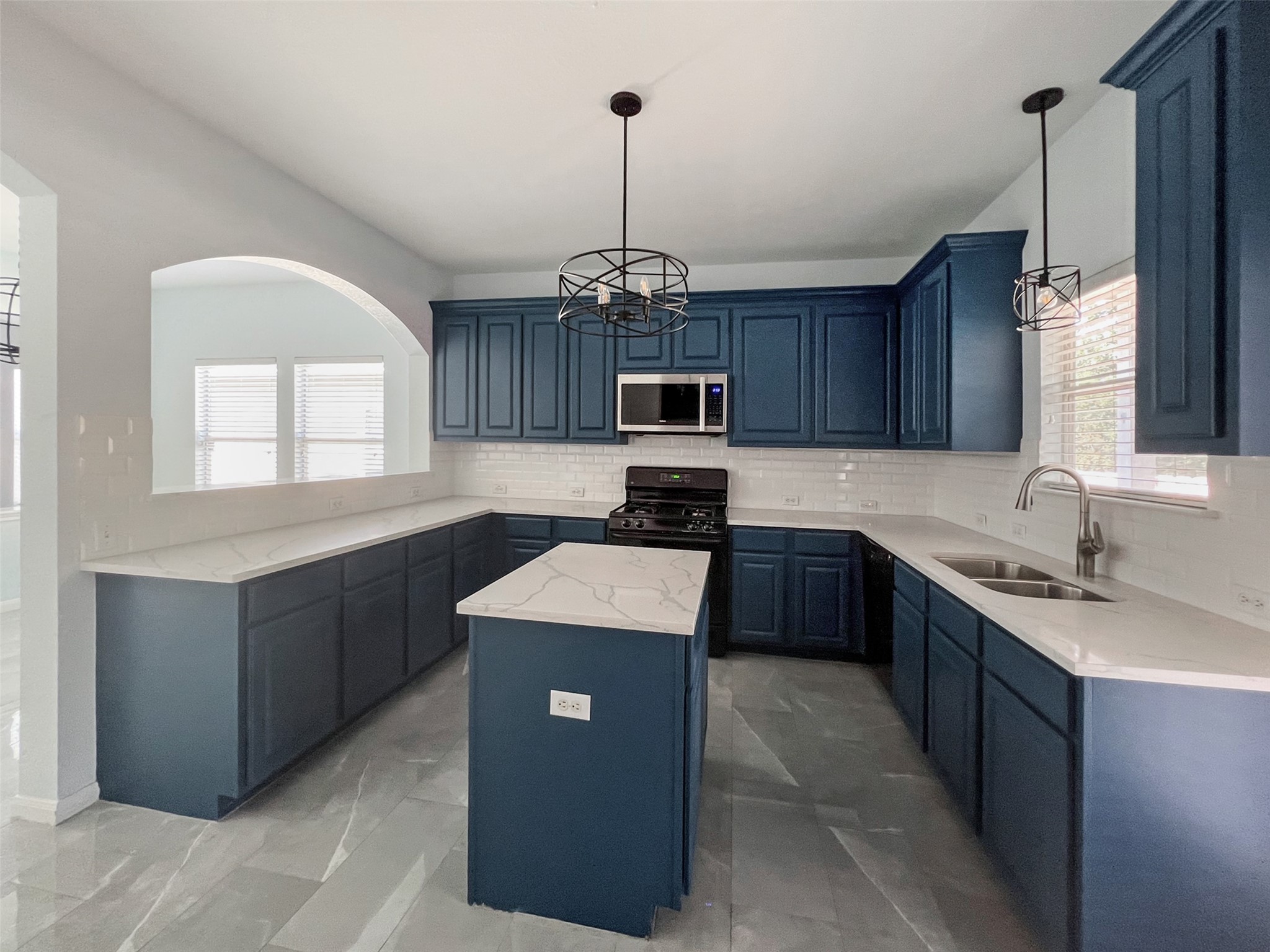 3917 Bronco Bend Loop Austin, TX 78744 - Photo 12 of 40 Kitchen Open to Dining and Living Rooms