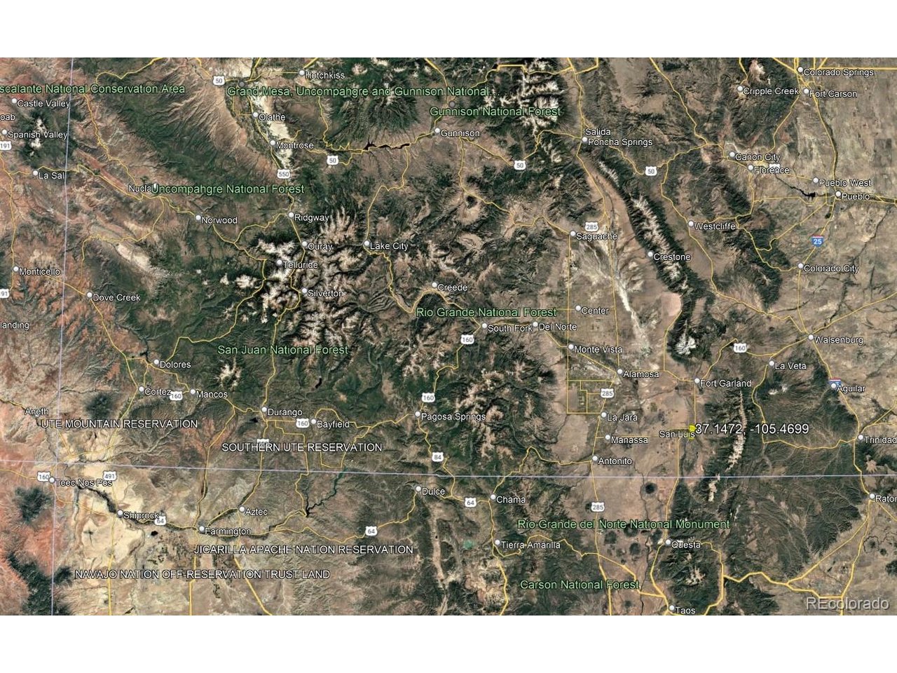 5 North Canyon Road San Luis, CO 81152 - Photo 24 of 25 a view of a city with lush green forest