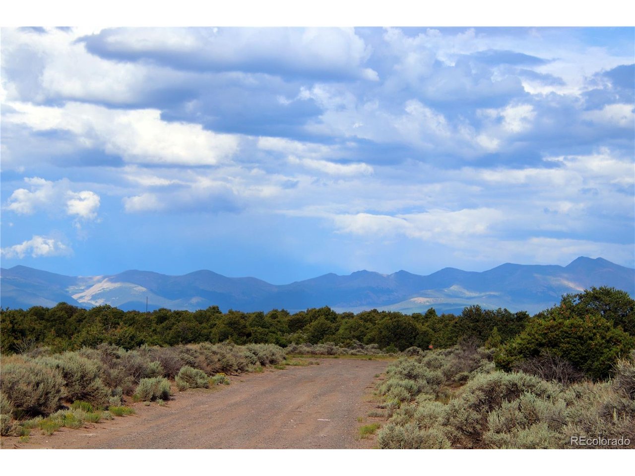 5 North Canyon Road San Luis, CO 81152 - Photo 5 of 25 a view of a city with mountain in the background