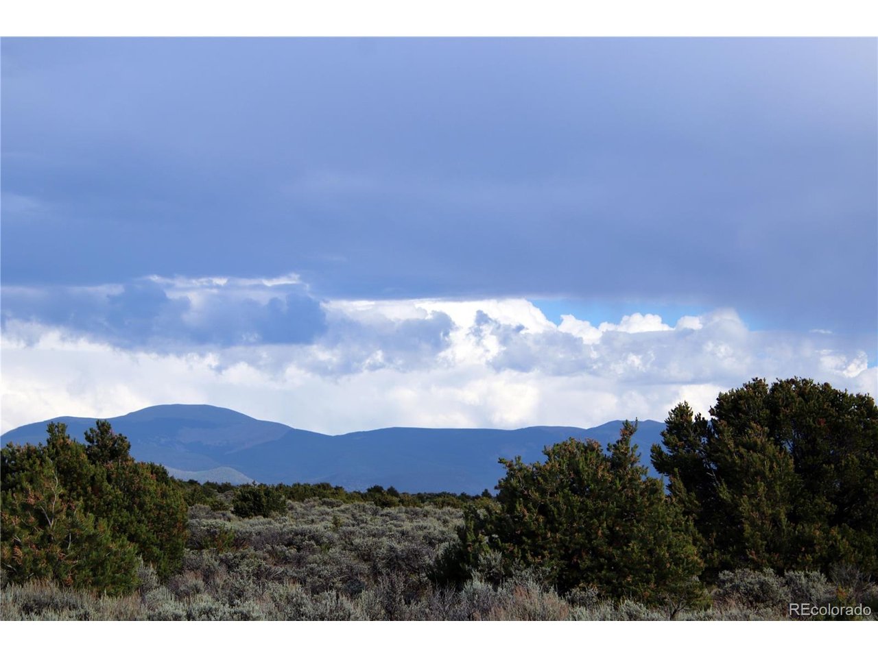 5 North Canyon Road San Luis, CO 81152 - Photo 7 of 25 a view of an outdoor space and mountains in the background