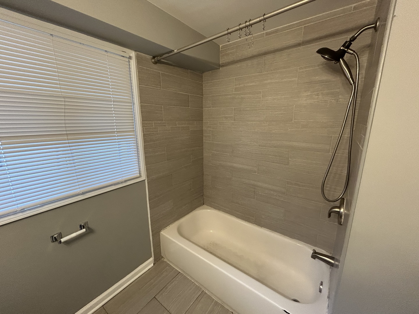 3124 173rd Street Hazel Crest, IL 60429 - Photo 11 of 18 a bathroom with a white shower a toilet and a sink