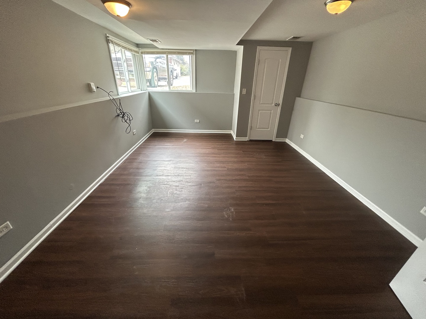 3124 173rd Street Hazel Crest, IL 60429 - Photo 14 of 18 an empty room with wooden floor and windows