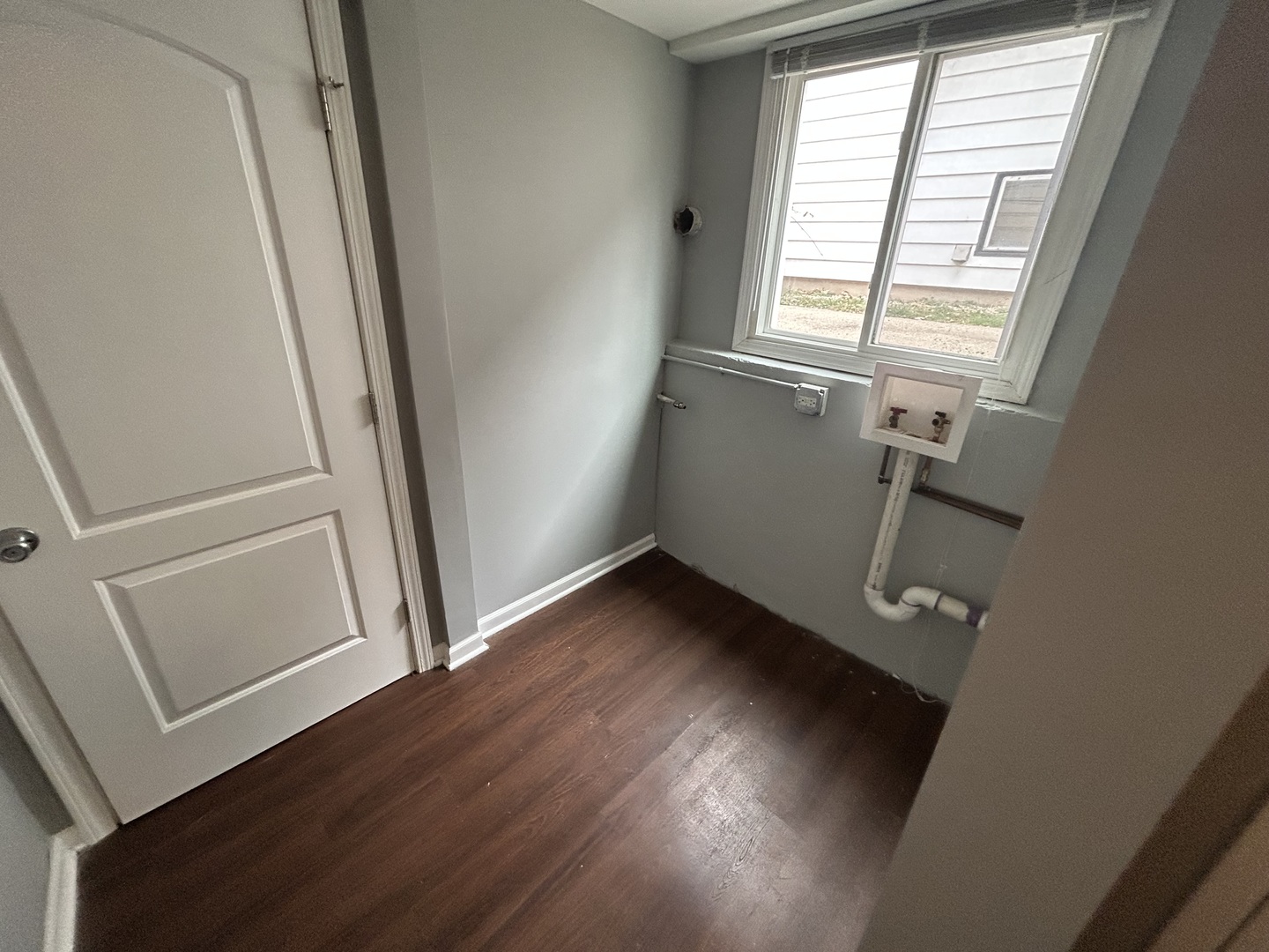3124 173rd Street Hazel Crest, IL 60429 - Photo 15 of 18 a view of an empty room with wooden floor and a window