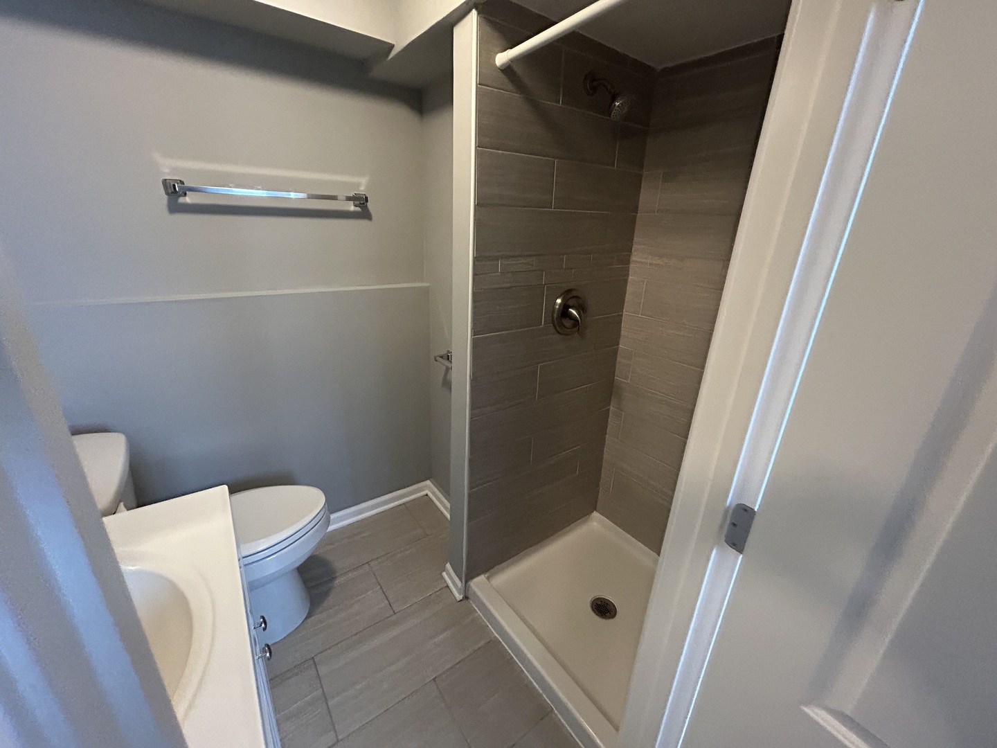 3124 173rd Street Hazel Crest, IL 60429 - Photo 16 of 18 a bathroom with a shower and toilet