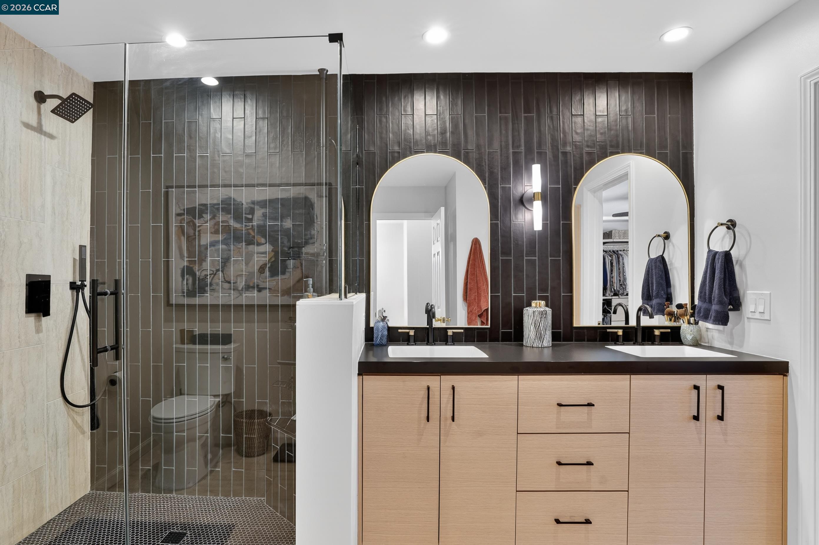 1812 Wildbrook Court, Unit C Concord, CA 94521 - Photo 2 of 35 a bathroom with double vanity sinks and a shower