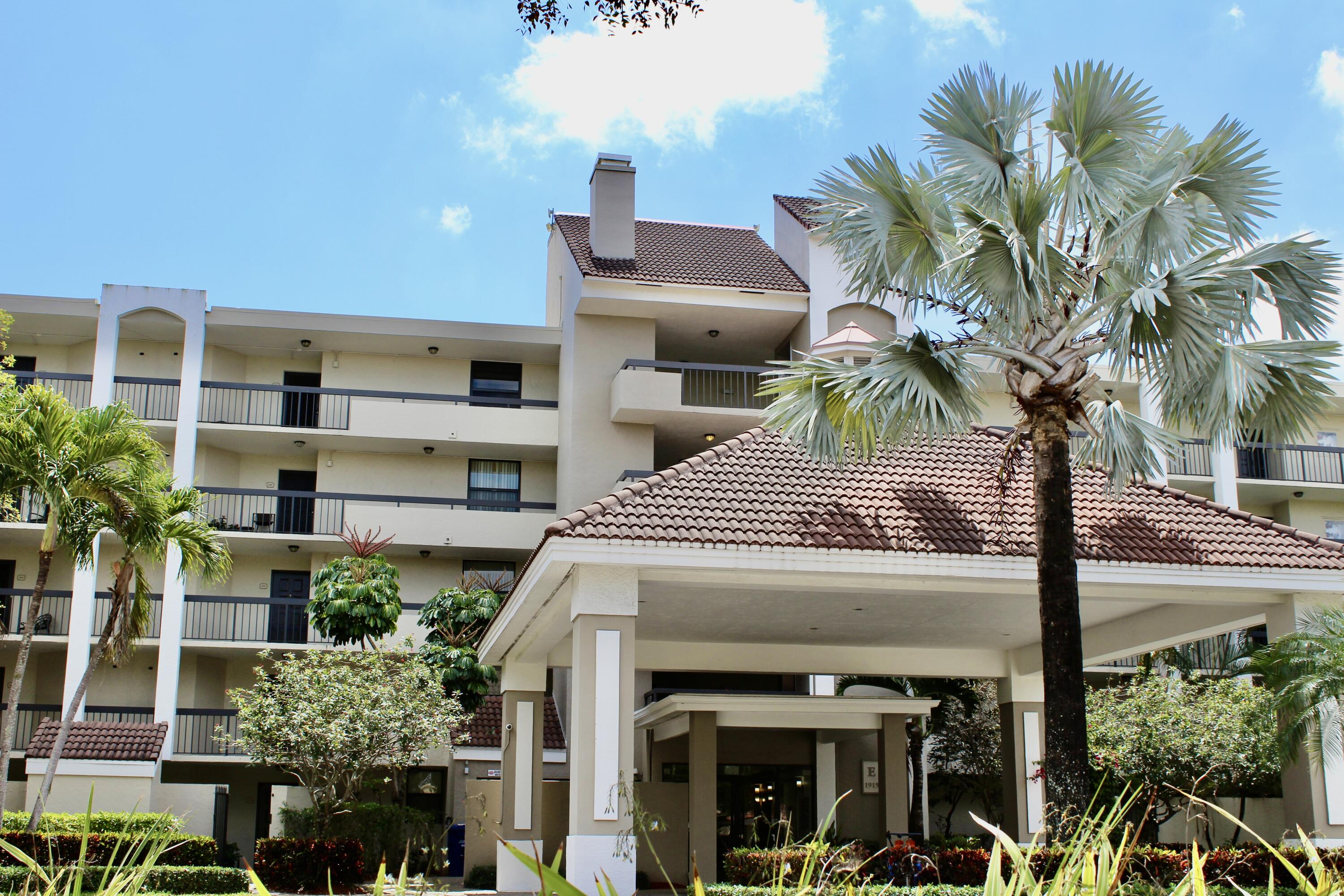 a view of a house with a palm tree