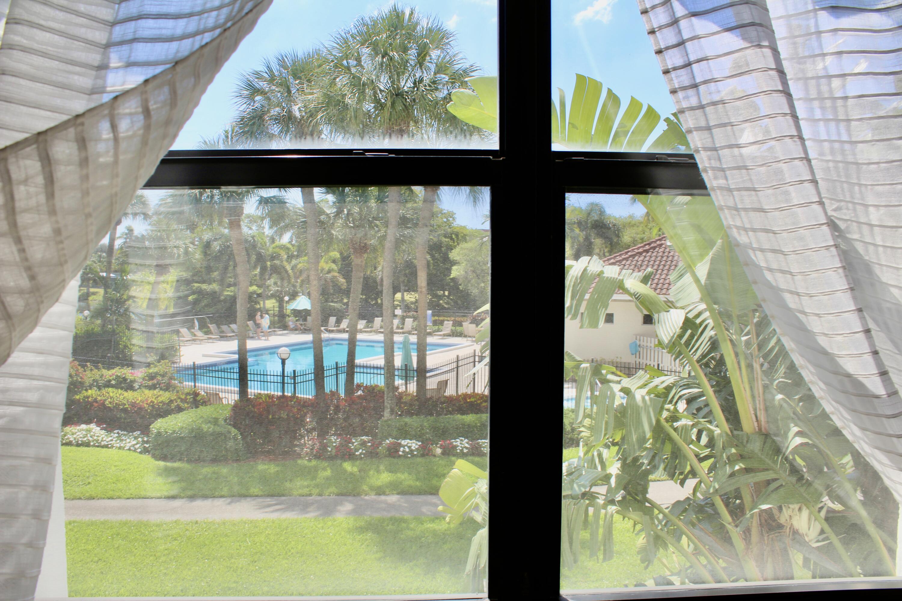 1915 Lavers Circle, Unit E209 Delray Beach, FL 33444 - Photo 14 of 20 a view of outdoor from window