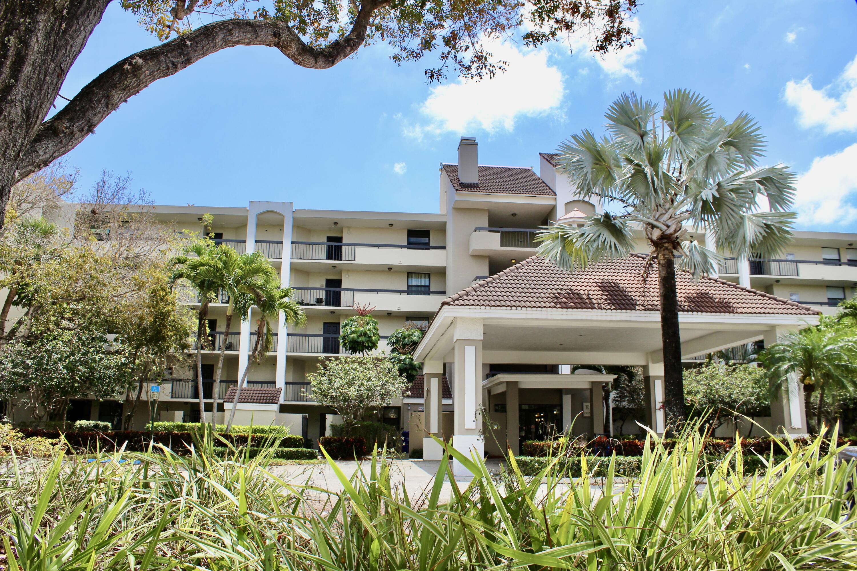 1915 Lavers Circle, Unit E209 Delray Beach, FL 33444 - Photo 20 of 20 a view of a garden with plants