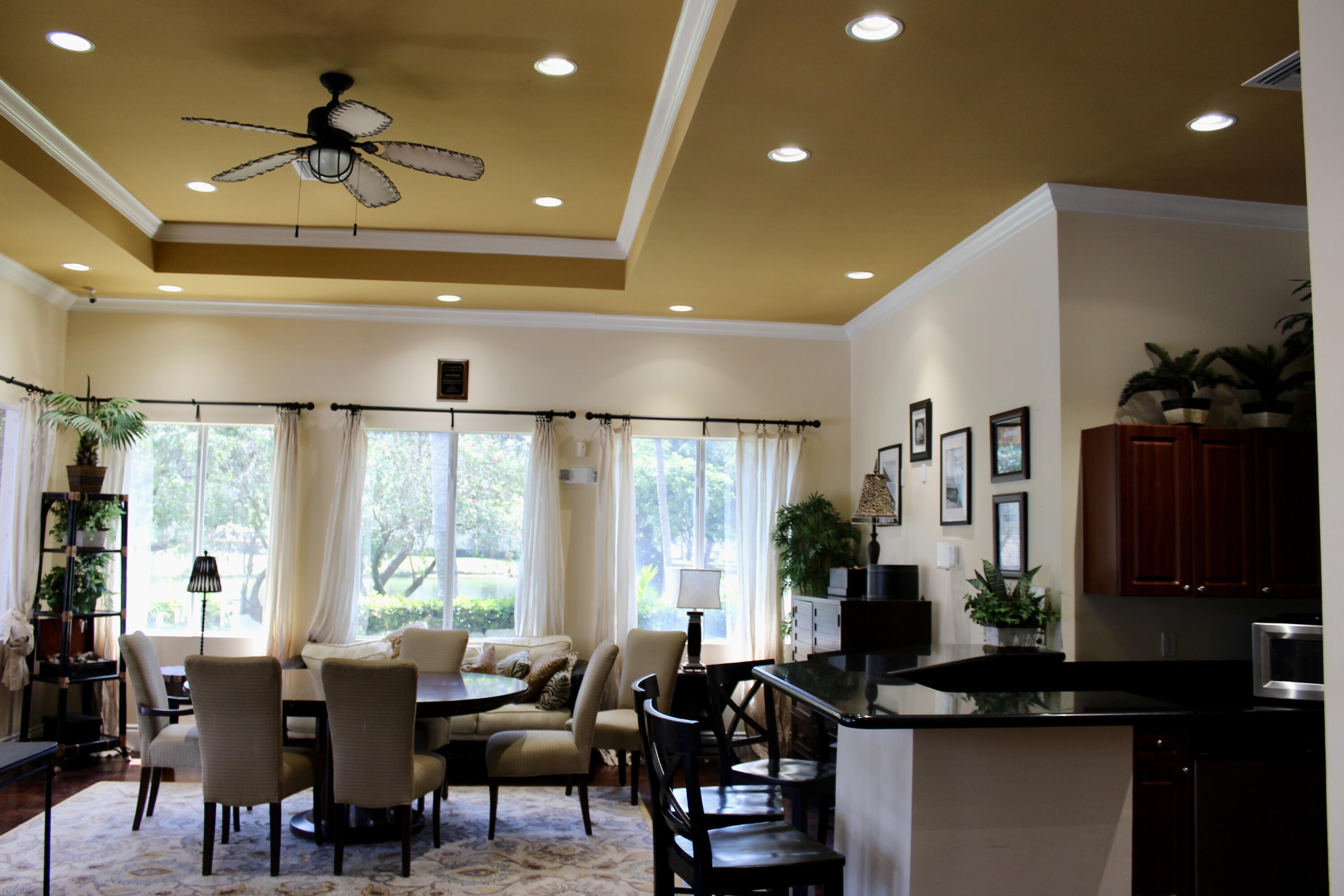 1915 Lavers Circle, Unit E209 Delray Beach, FL 33444 - Photo 8 of 20 a view of a livingroom with furniture window and outside view