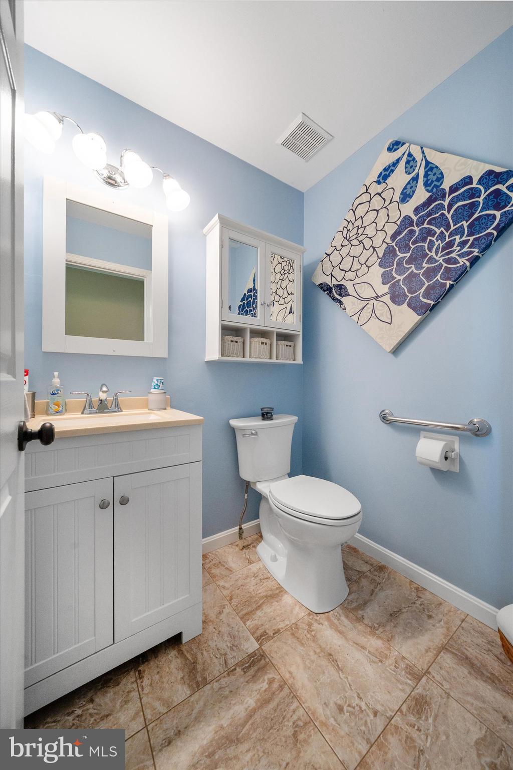 4012 Homeville Road Cochranville, PA 19330 - Photo 21 of 57 a bathroom with a toilet sink and mirror