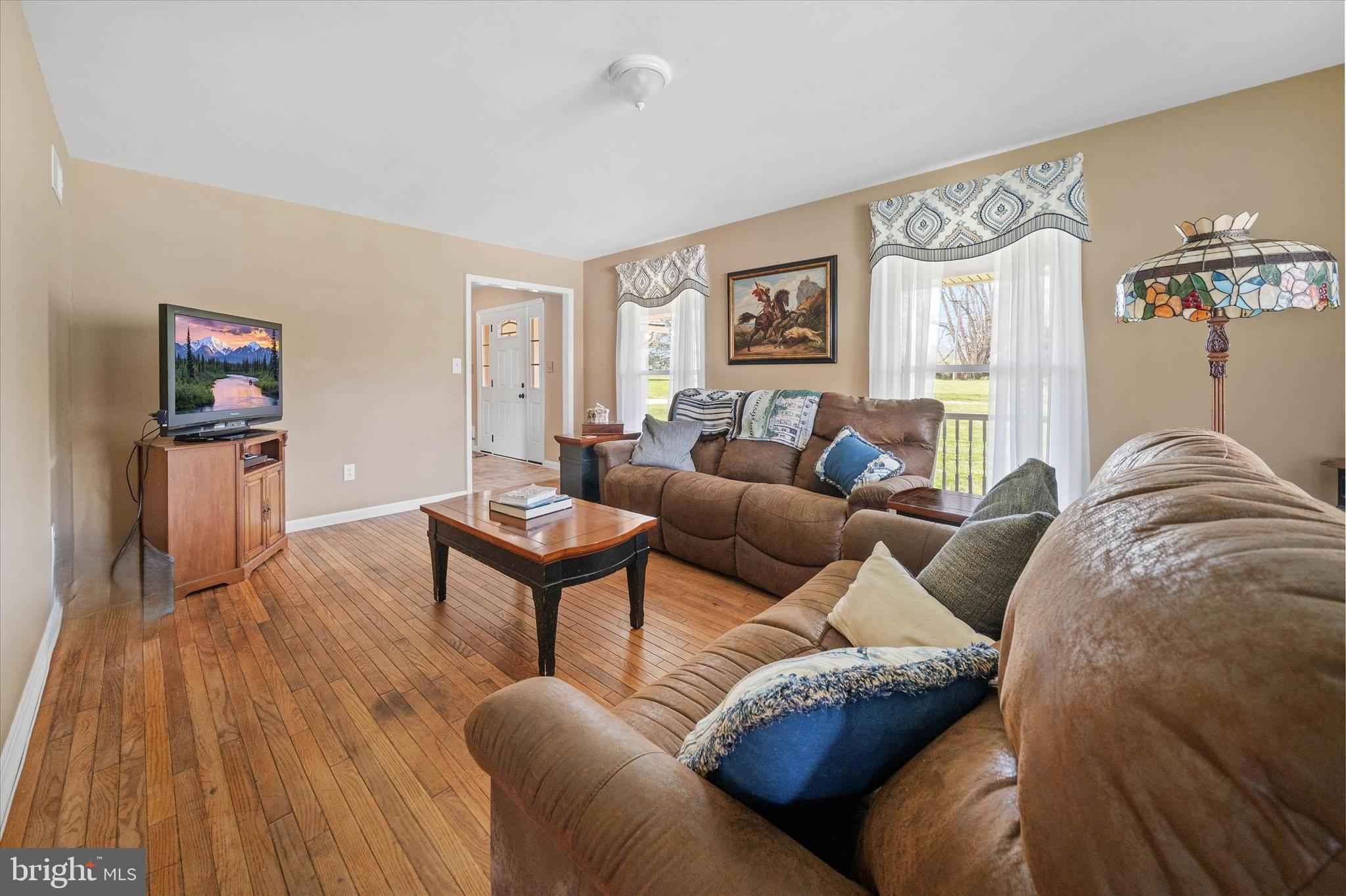 4012 Homeville Road Cochranville, PA 19330 - Photo 28 of 57 a living room with furniture and a wooden floor