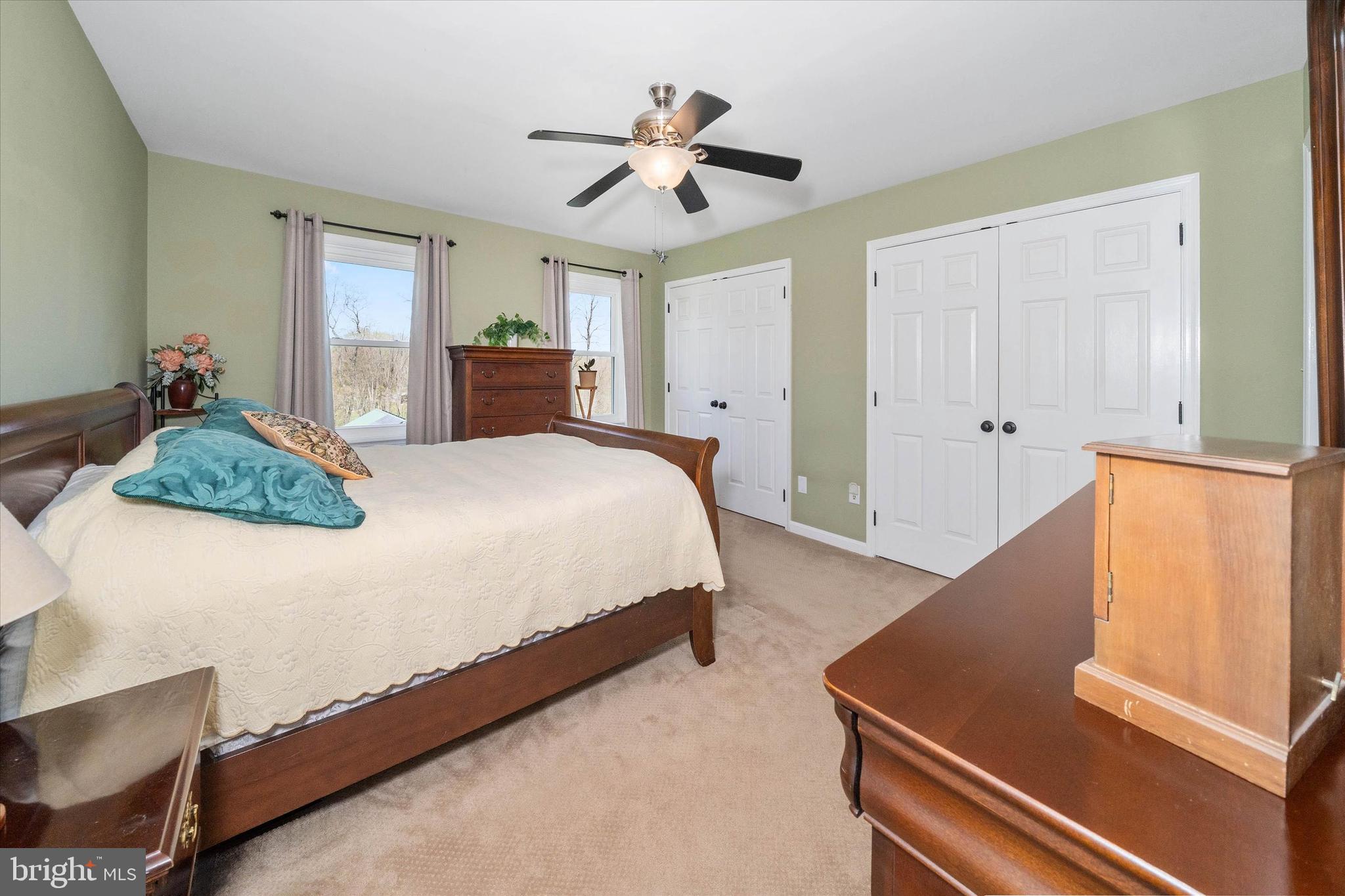 4012 Homeville Road Cochranville, PA 19330 - Photo 43 of 57 a bedroom with a bed and a chandelier