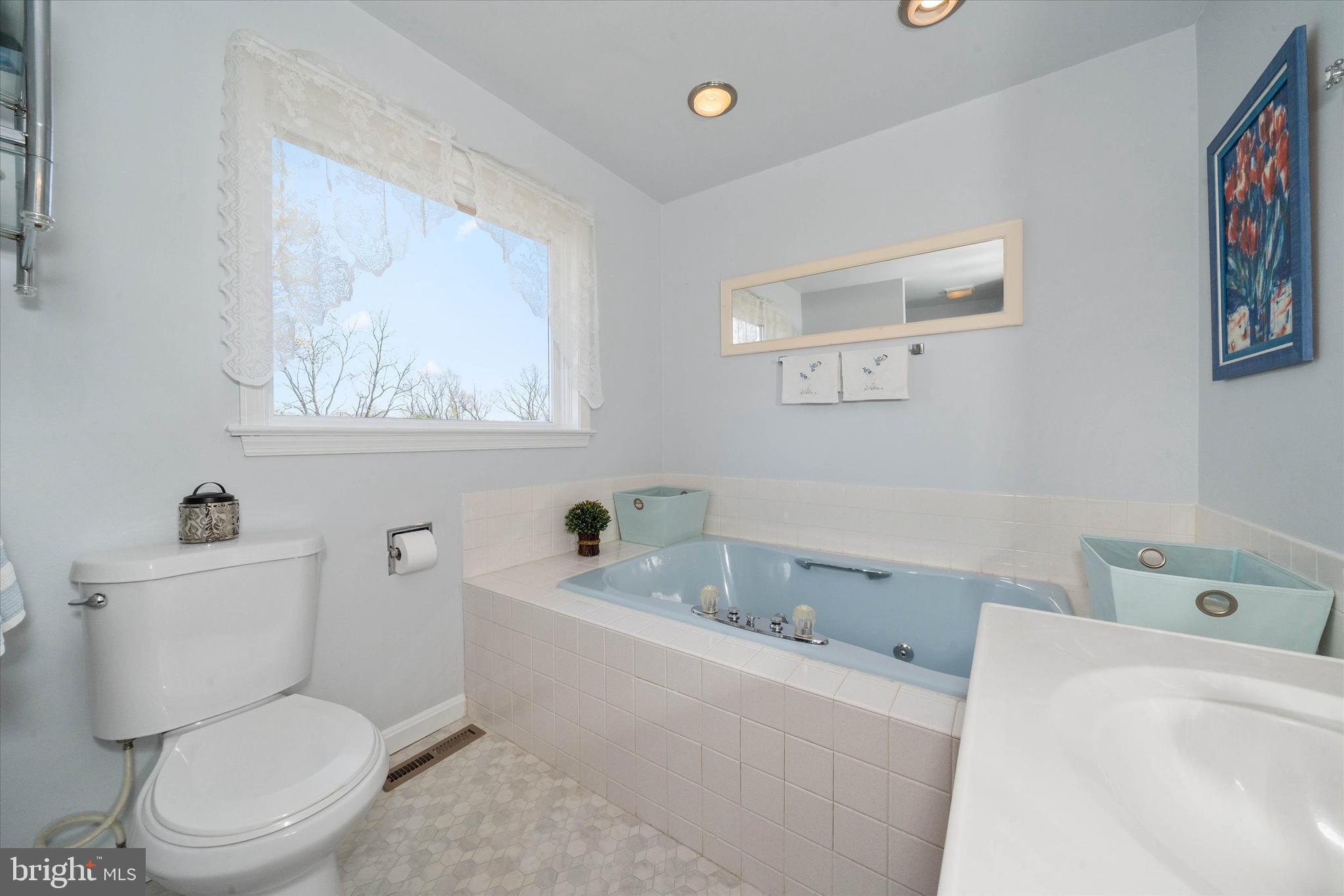 4012 Homeville Road Cochranville, PA 19330 - Photo 45 of 57 a white toilet sitting next to a bathroom sink