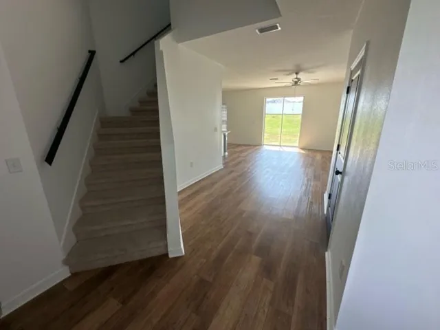 a view of entryway with wooden floor