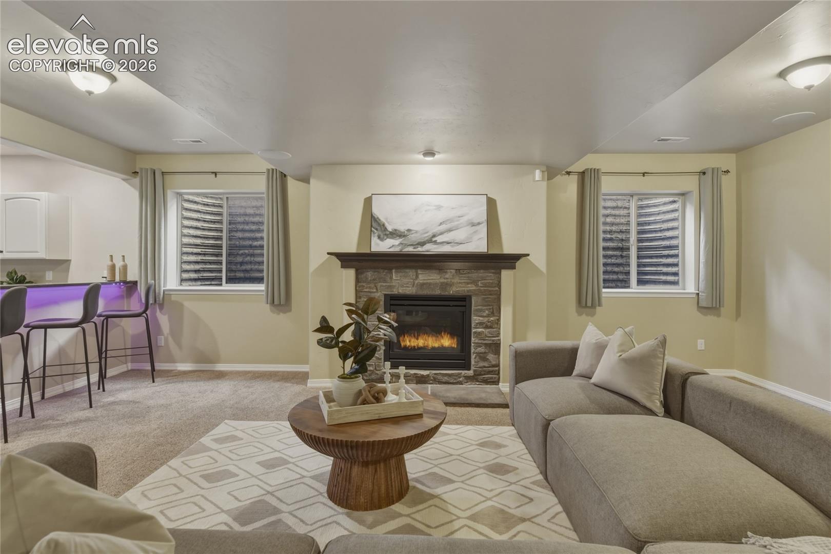 1118 Spectrum Loop Colorado Springs, CO 80921 - Photo 29 of 50 Stone-clad fireplace with a wood mantel