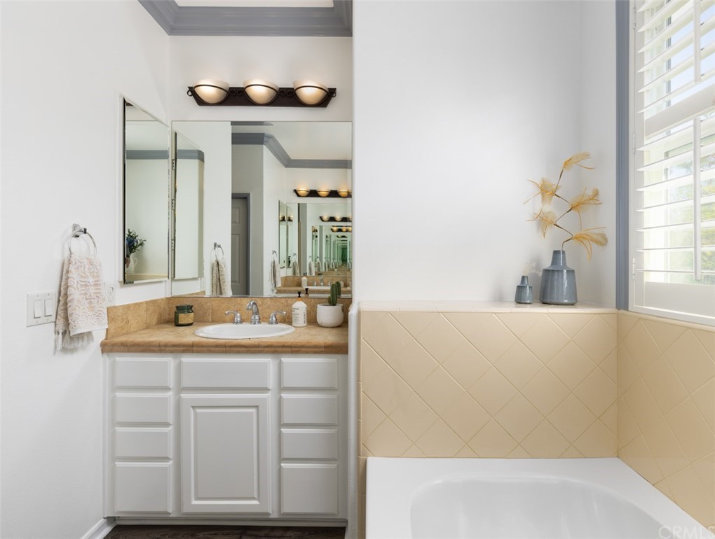 9 Thorp Ladera Ranch Ladera Ranch, CA 92694 - Photo 17 of 34 a bathroom with a sink and a mirror