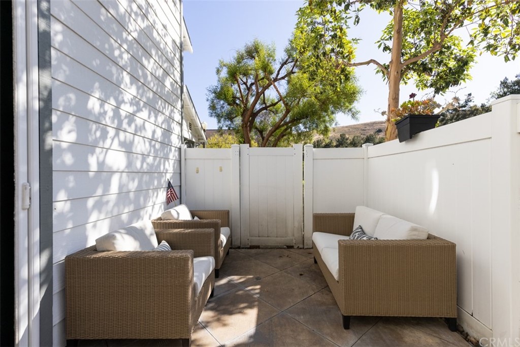 9 Thorp Ladera Ranch Ladera Ranch, CA 92694 - Photo 25 of 34 a backyard of a house with table and sofas