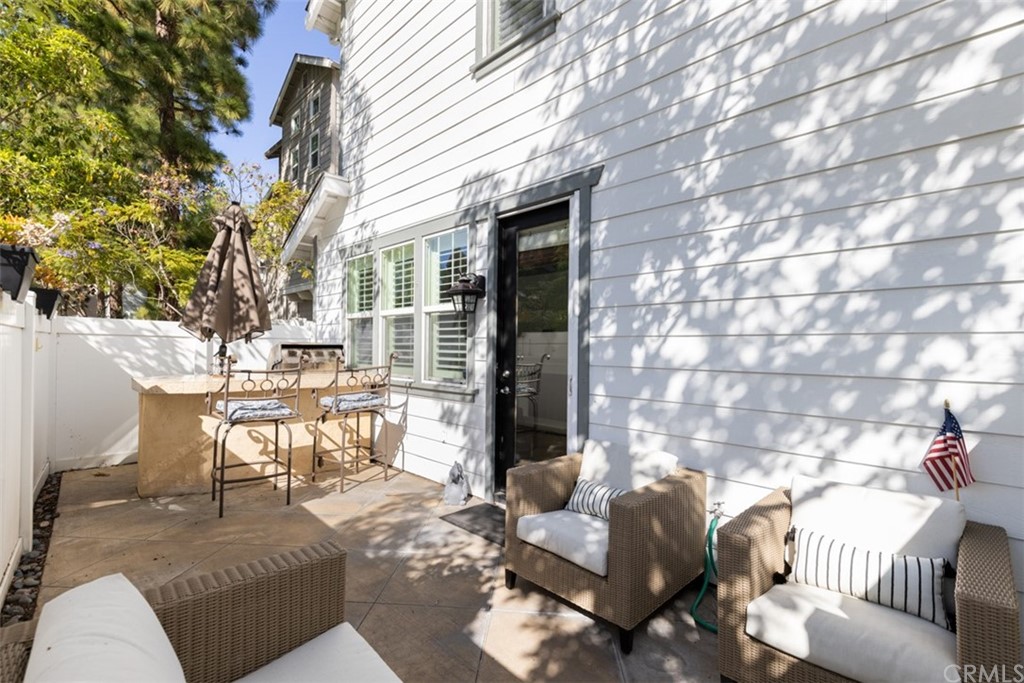 9 Thorp Ladera Ranch Ladera Ranch, CA 92694 - Photo 26 of 34 a view of a patio with couches table and chairs and potted plants