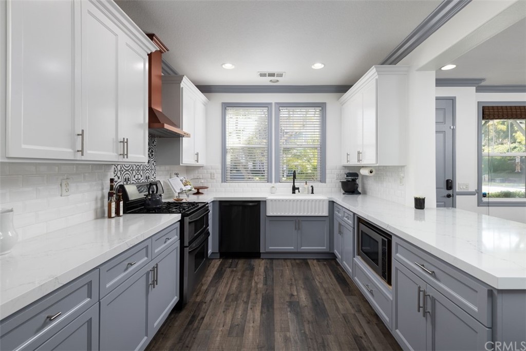 9 Thorp Ladera Ranch Ladera Ranch, CA 92694 - Photo 3 of 34 a kitchen with a sink a window and cabinets