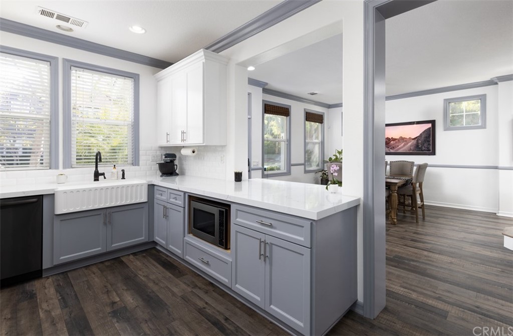 9 Thorp Ladera Ranch Ladera Ranch, CA 92694 - Photo 4 of 34 a kitchen with a sink stove and cabinets