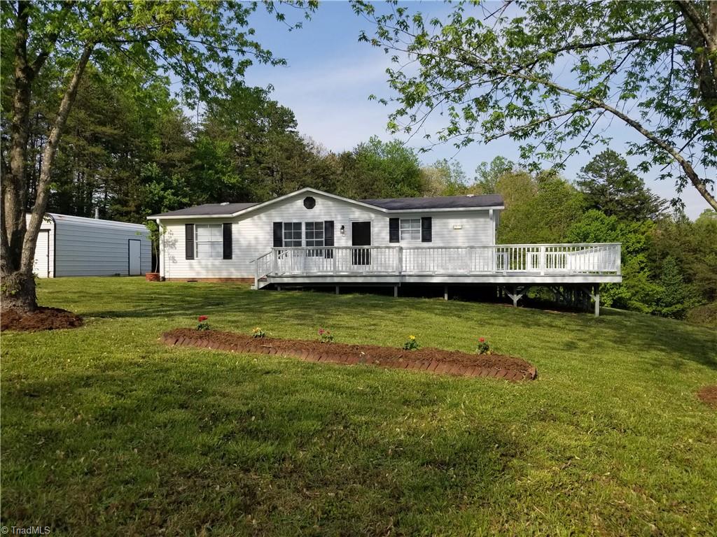 1309 Gordon Road Pinnacle, NC 27043 - Photo 2 of 41 View from front yard. New mulch and flowers