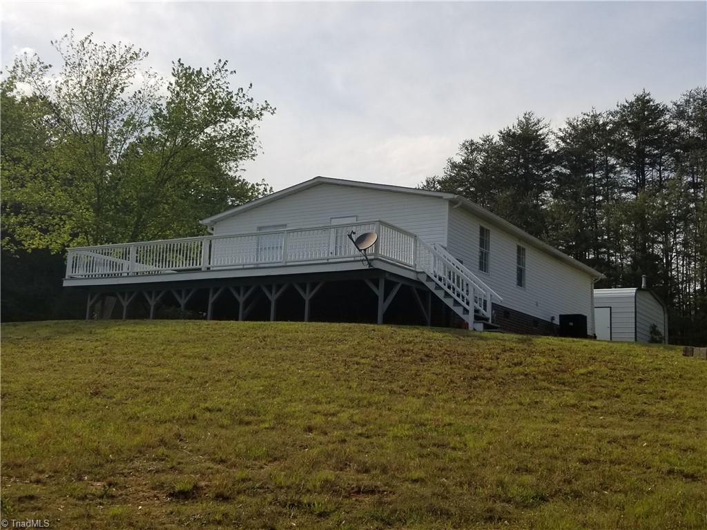 1309 Gordon Road Pinnacle, NC 27043 - Photo 14 of 41 View of side deck and back of home