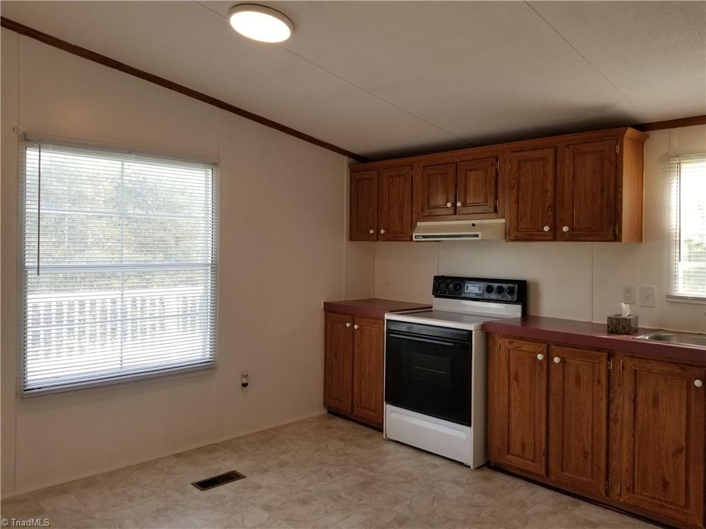 1309 Gordon Road Pinnacle, NC 27043 - Photo 22 of 41 Another view of kitchen facing side deck
