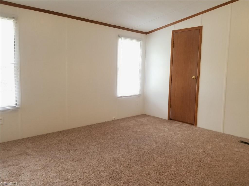 1309 Gordon Road Pinnacle, NC 27043 - Photo 23 of 41 Primary bedroom with walk-in closet and large bathroom