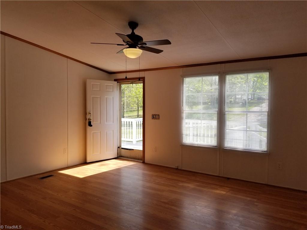 1309 Gordon Road Pinnacle, NC 27043 - Photo 26 of 41 Huge Living room with fresh paint, new blinds, new ceiling fan