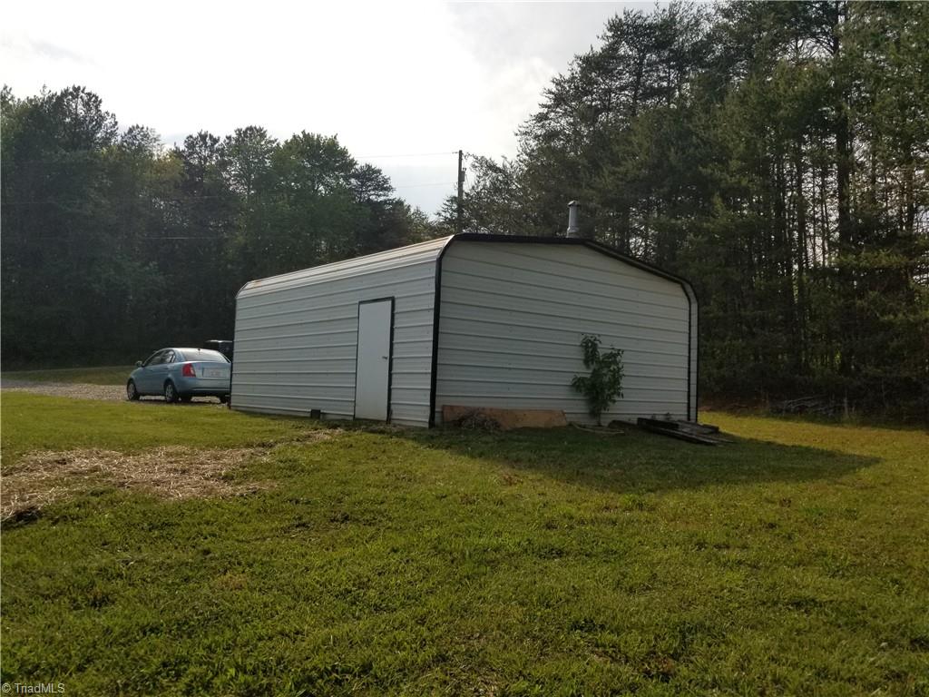 1309 Gordon Road Pinnacle, NC 27043 - Photo 31 of 41 Rear view of double metal garage (21 x 24) with new wiring and LED lighting