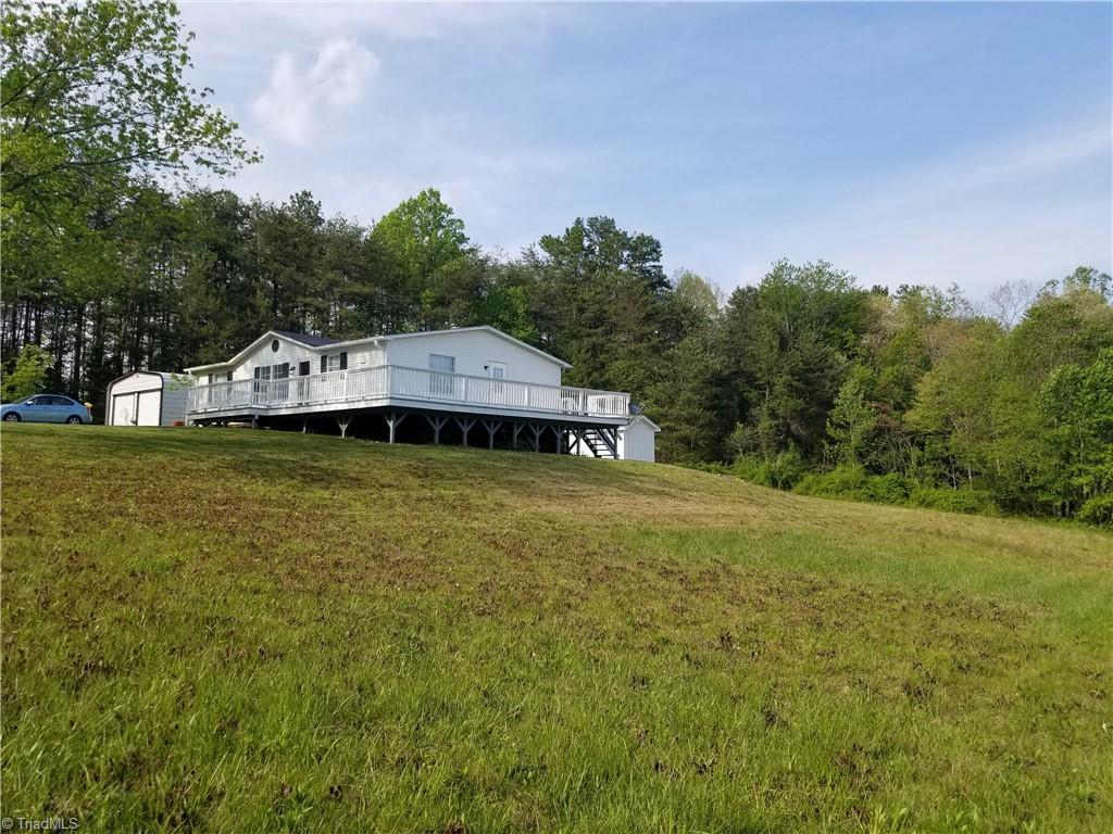 1309 Gordon Road Pinnacle, NC 27043 - Photo 10 of 41 Side view of the property showing huge decks. Plenty of room with over 2.3 acres!