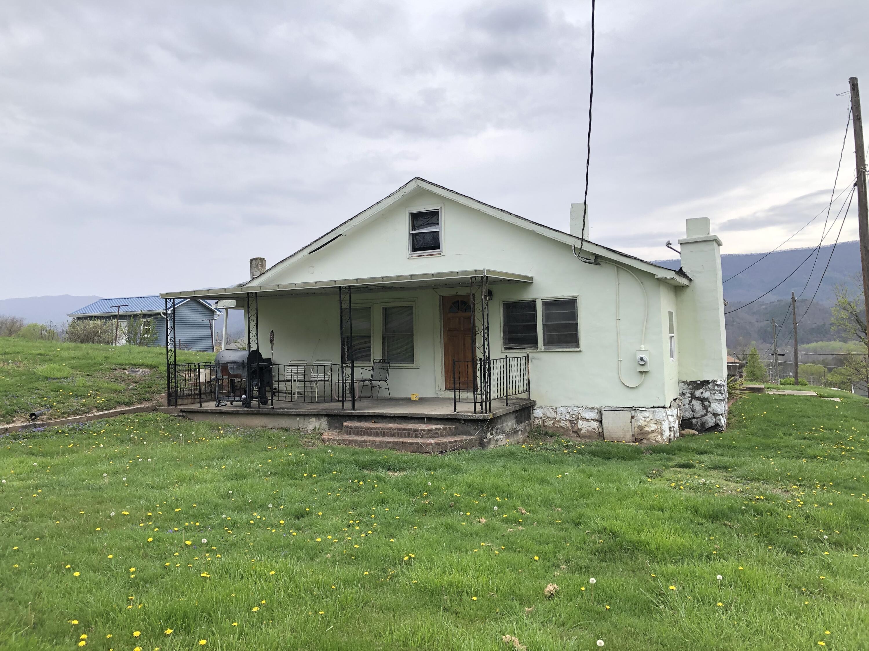 a front view of a house with patio