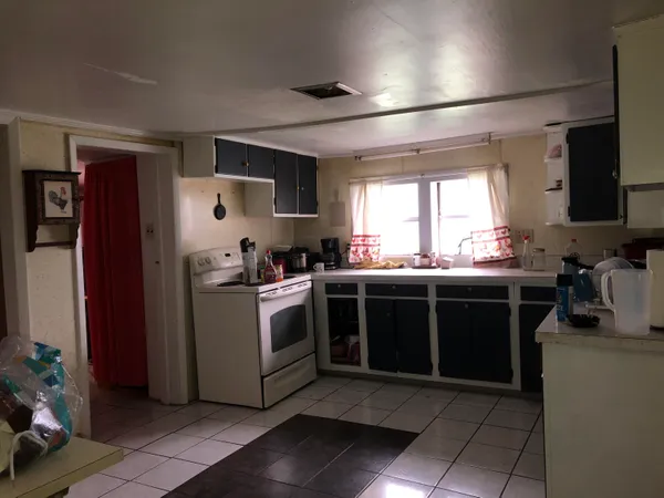 a kitchen with stainless steel appliances granite countertop a stove and a refrigerator