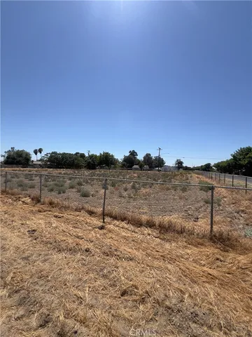 a view of a lake with beach in background