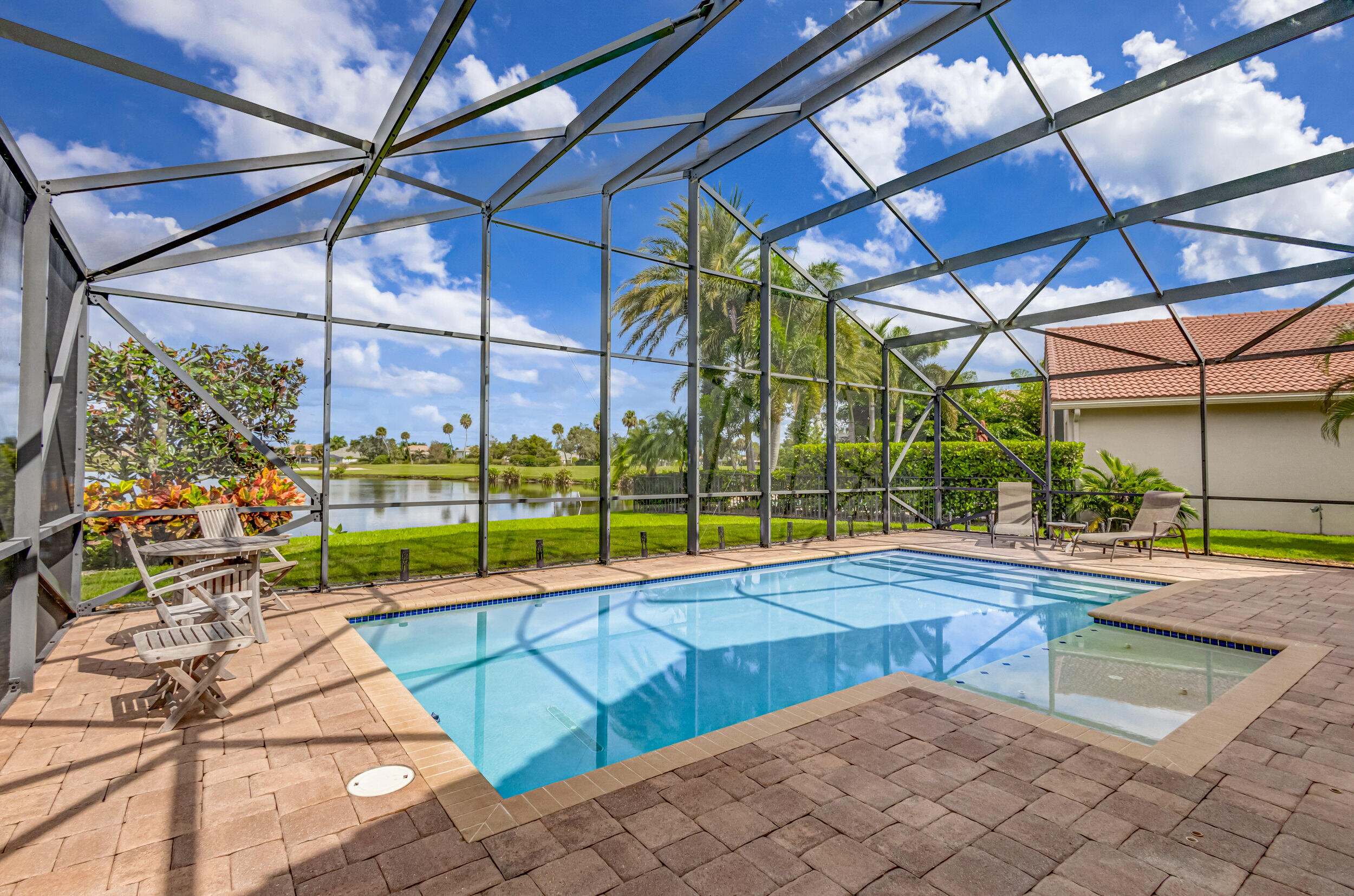 237 Carina Drive Jupiter, FL 33478 - Photo 18 of 73 a view of swimming pool with a patio