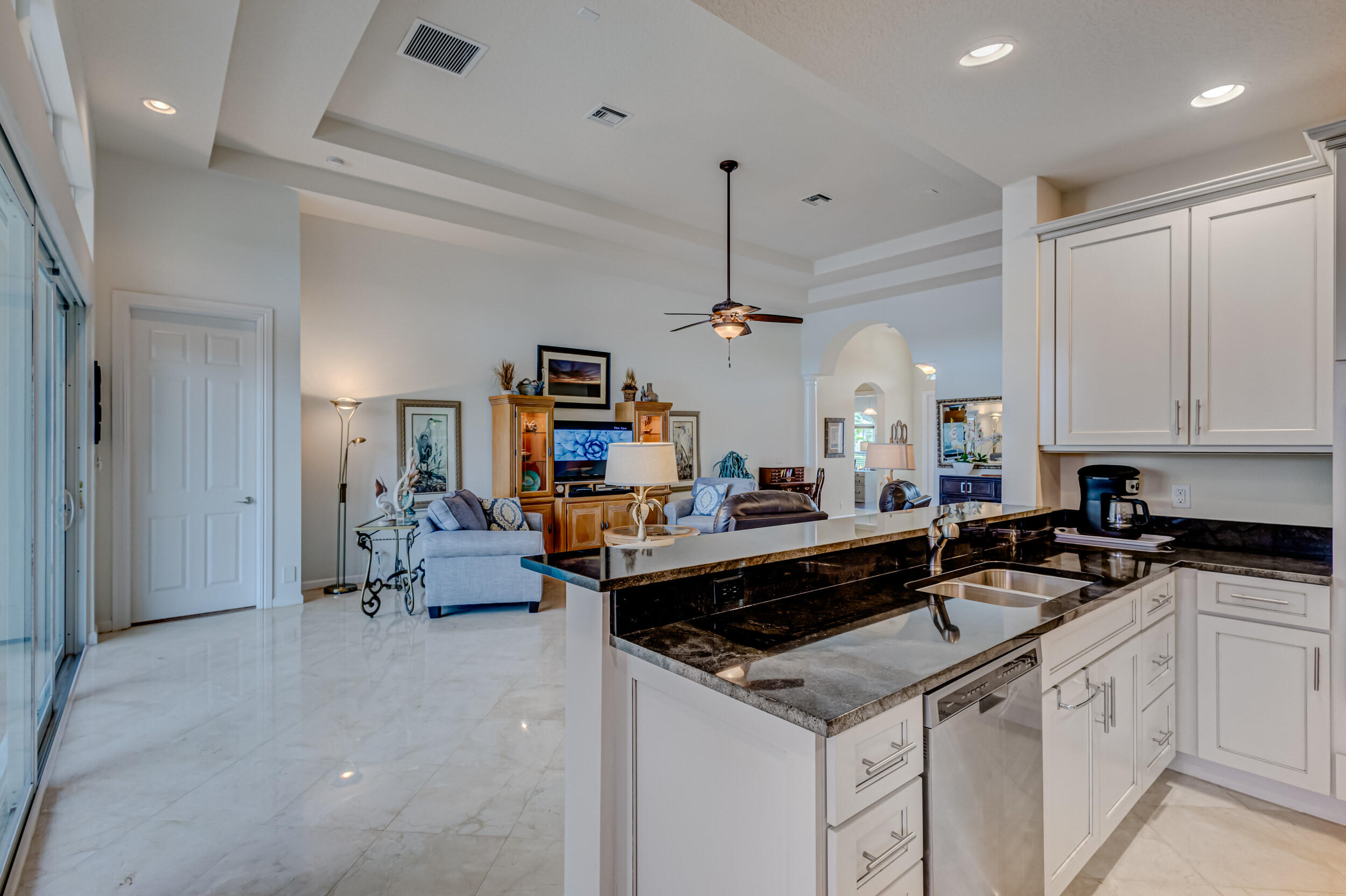 237 Carina Drive Jupiter, FL 33478 - Photo 33 of 73 a kitchen that has a sink and a stove