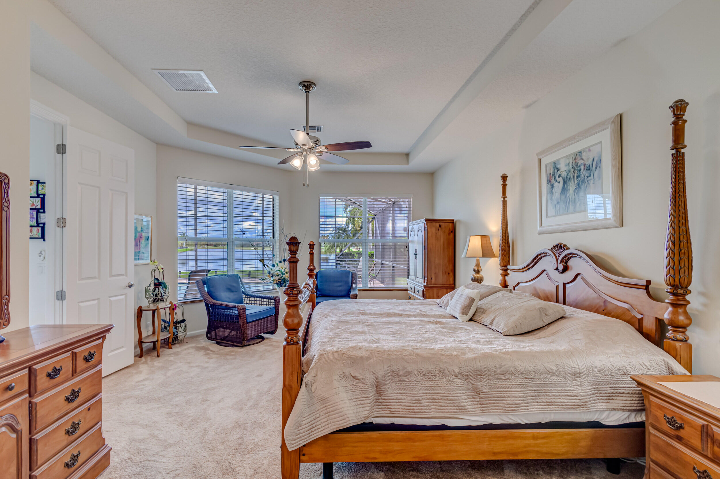 237 Carina Drive Jupiter, FL 33478 - Photo 39 of 73 a bedroom with a bed couch and window