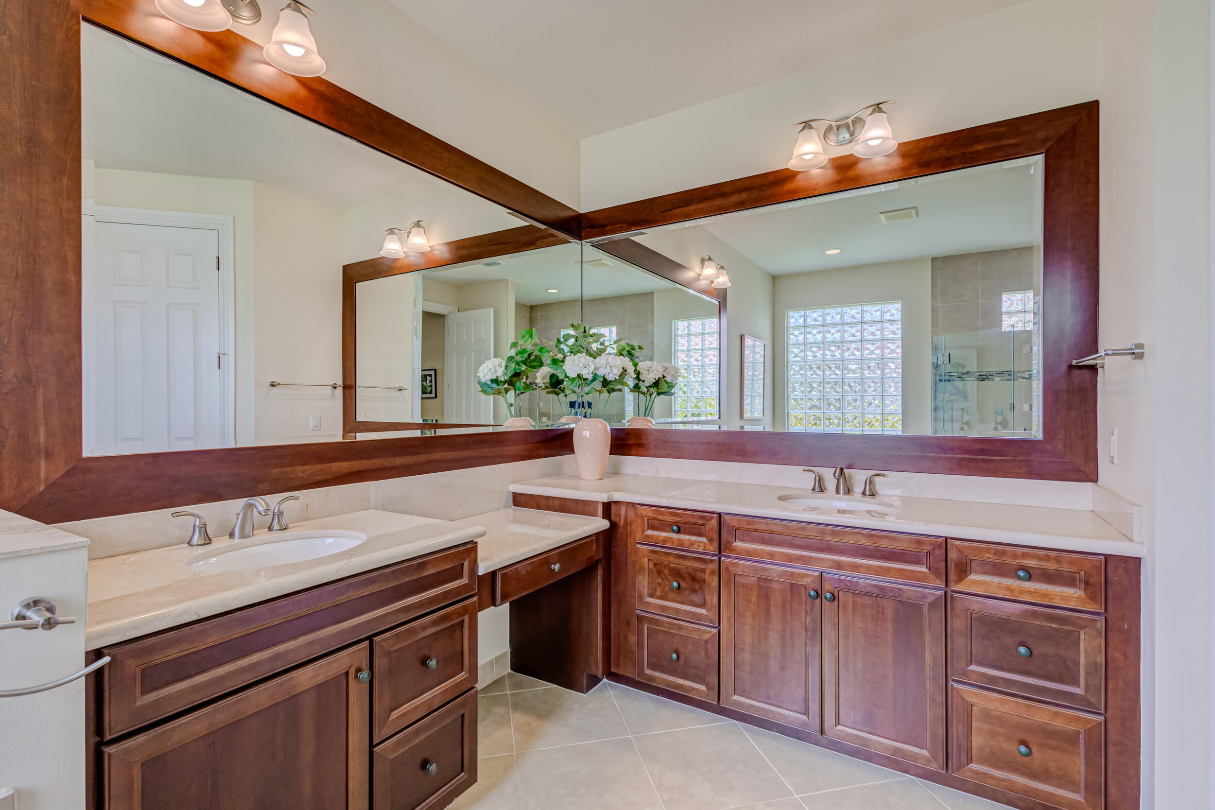237 Carina Drive Jupiter, FL 33478 - Photo 41 of 73 a bathroom with a sink and a mirror