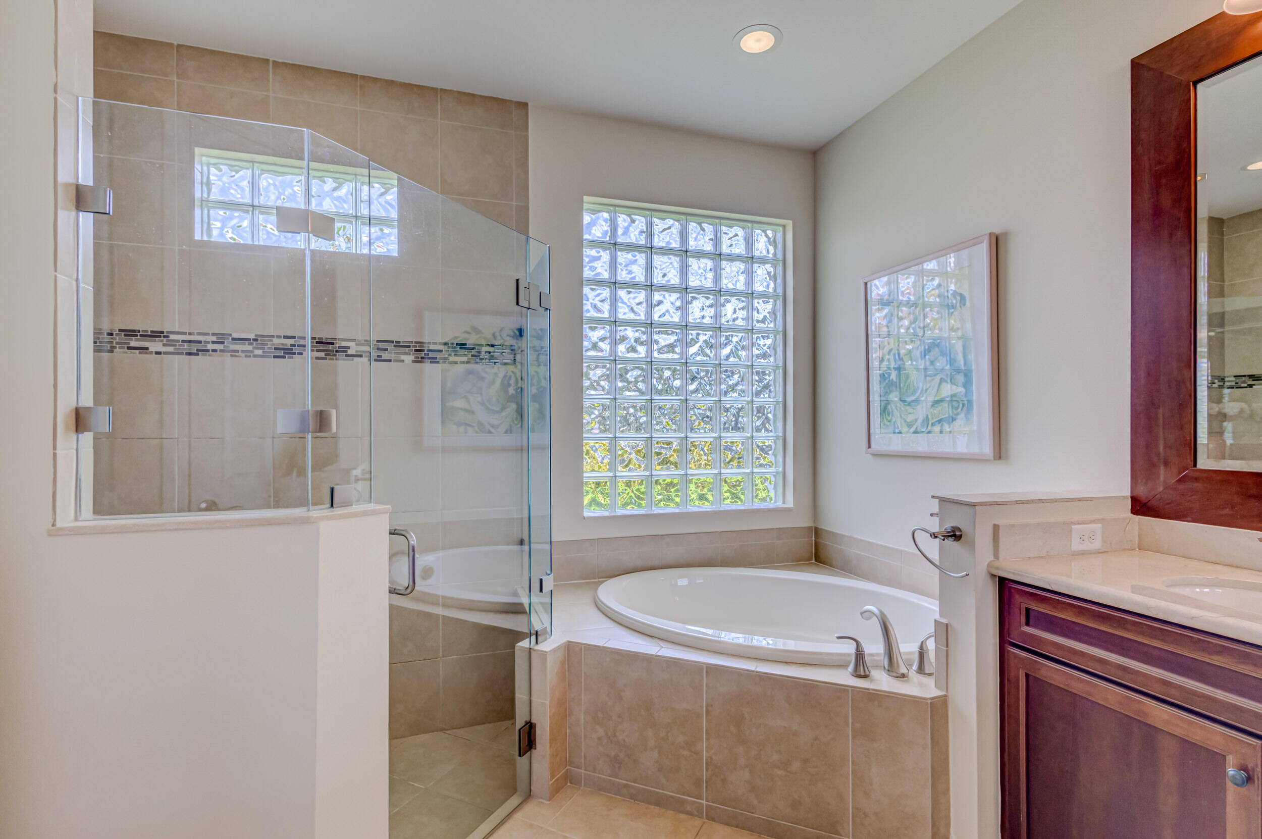 237 Carina Drive Jupiter, FL 33478 - Photo 42 of 73 a bathroom with a tub sink and mirror